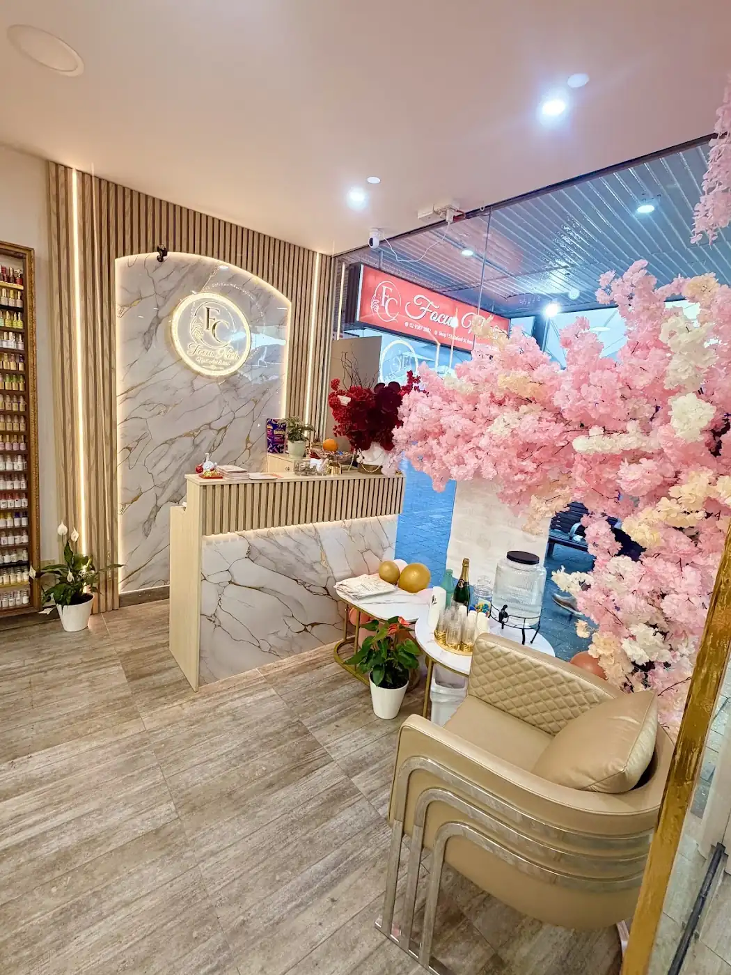 Inside Focus Nails: manicure desks under a pink blossom tree